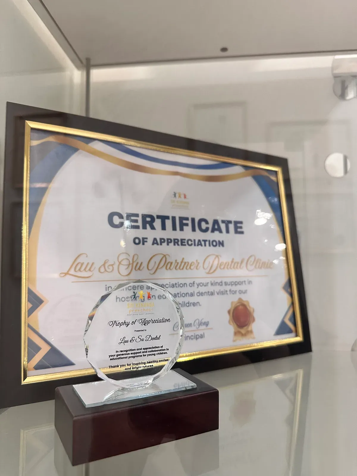 Framed certificate of appreciation awarded to Lau & Su Partners Dental Clinic for supporting community oral health in Bukit Jalil