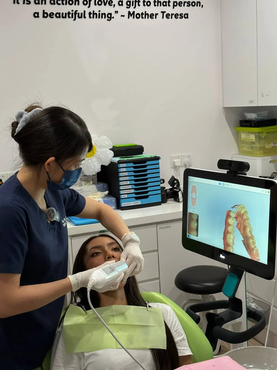 Patient having a digital intraoral scan during an orthodontic consultation, the first step in planning braces or clear aligners